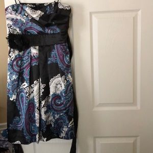 Knee length strapless dress.